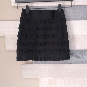 Tight black skirt with ruffle details